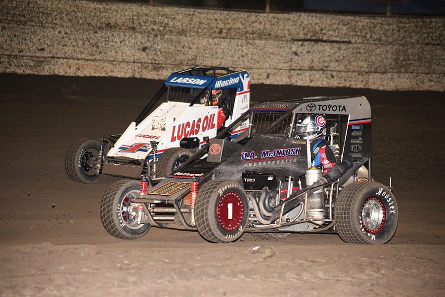 Cannon McIntosh (08) battles Kyle Larson for the race lead during Friday's Turkey Night Grand Prix feature at Ventura Raceway. (Richard Bales Photo)