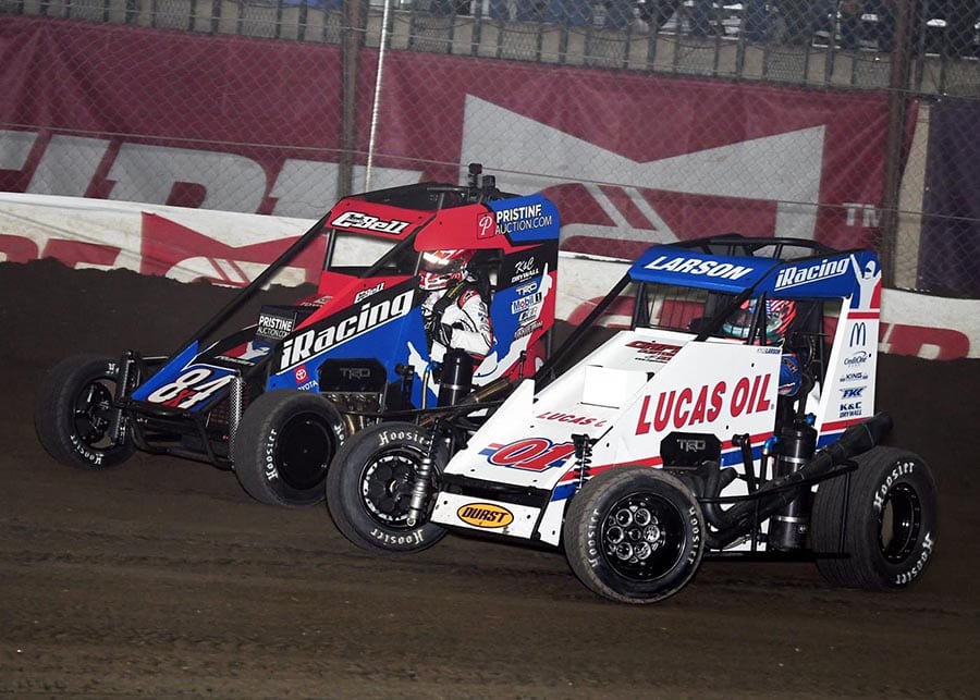 Kyle Larson (01) battles Christopher Bell for the race lead during Saturday's Chili Bowl finale at Tulsa Expo Raceway. (Frank Smith Photo)