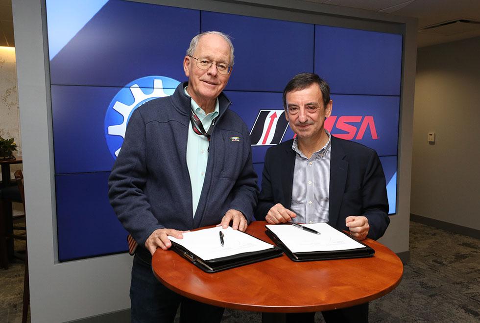 IMSA Chairman Jim France (left) and ACO President Pierre Fillon (right) pose for a photo prior to announcing the planned agreement between their two sanctioning bodies. (IMSA Photo)