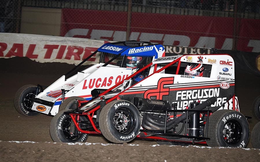 Jonathan Beason (8) battles Kyle Larson for the race lead during Tuesday's Warren CAT Qualifying Night Chili Bowl feature at Tulsa Expo Raceway. (Frank Smith Photo)