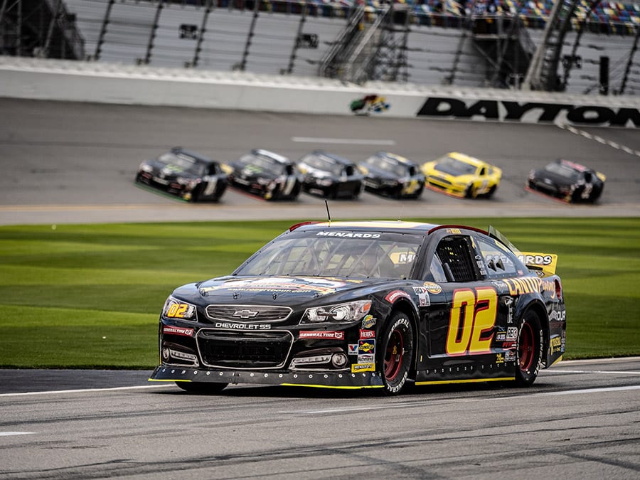 The Our Motorsports No. 02 Chevrolet drives down pit road as cars storm by during the ARCA Menards Series test at Daytona Int'l Speedway. (Jason Reasin Photo)