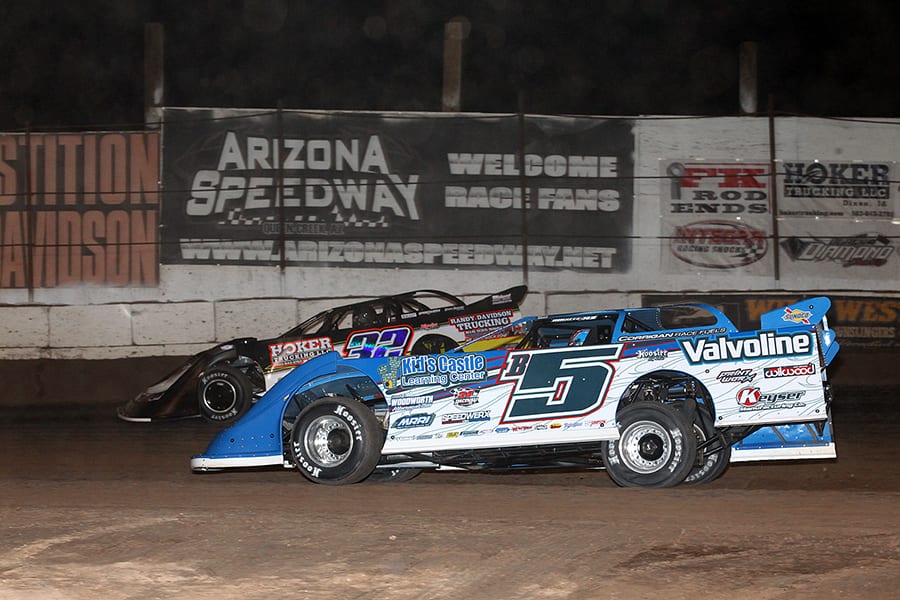 Brandon Sheppard (B5) races under Chris Simpson during Saturday's Wild West Shootout feature at Arizona Speedway. (Mike Ruefer Photo)