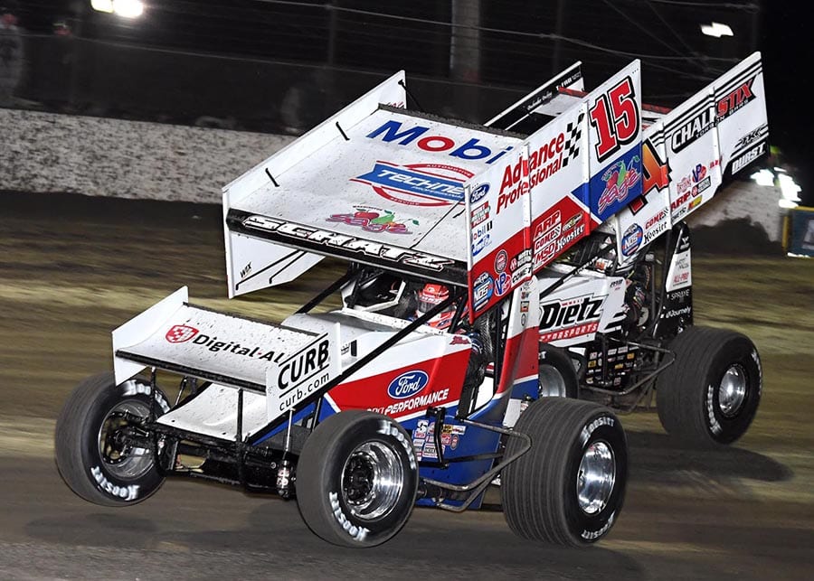 Donny Schatz (15) battles Parker Price-Miller during Friday's World of Outlaws NOS Energy Drink Sprint Car Series opener at Volusia Speedway Park. (Frank Smith Photo)