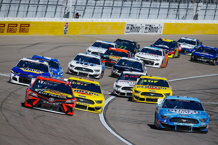 Drivers battle for position during a restart Sunday at Las Vegas Motor Speedway. (HHP/Chris Owens Photo)