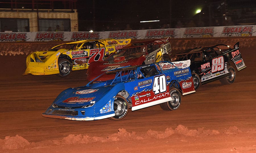 Joel Callahan (40), G.R. Smith (89), Pearson Lee Williams (2) and Hudson O'Neal battle four-wide during Saturday's Lucas Oil Late Model Dirt Series opener at Golden Isles Speedway. (Paul Arch Photo)