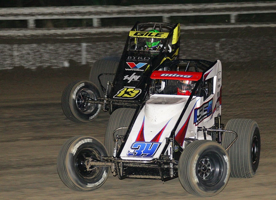 Sterling Cling (34) battles Dennis Gile during Friday's USAC AMSOIL National Sprint Car Series opener at Bubba Raceway Park. (Todd Ridgeway Photo)