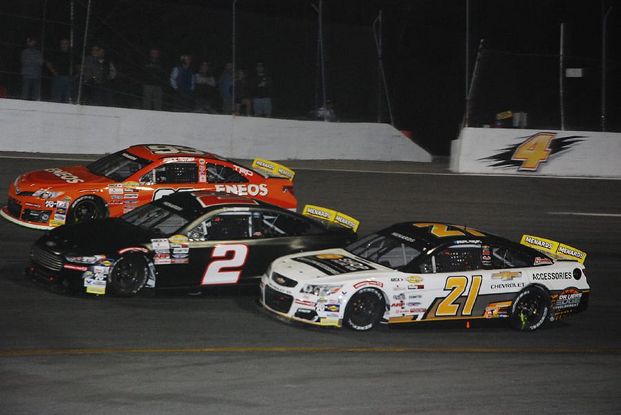 Sam Mayer (21), Derek Griffith (2) and Gracie Trotter race three-wide during Monday's ARCA Menards Series East opener at New Smyrna Speedway. (David Sink Photo)