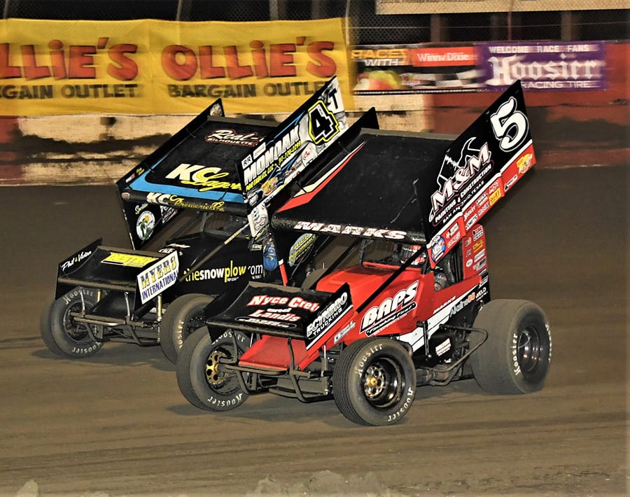 Brent Marks (5) battles Terry McCarl during Tuesday's Ollie's Bargain Outlet All Star Circuit of Champions feature at East Bay Raceway Park. (Al Steinberg Photo)