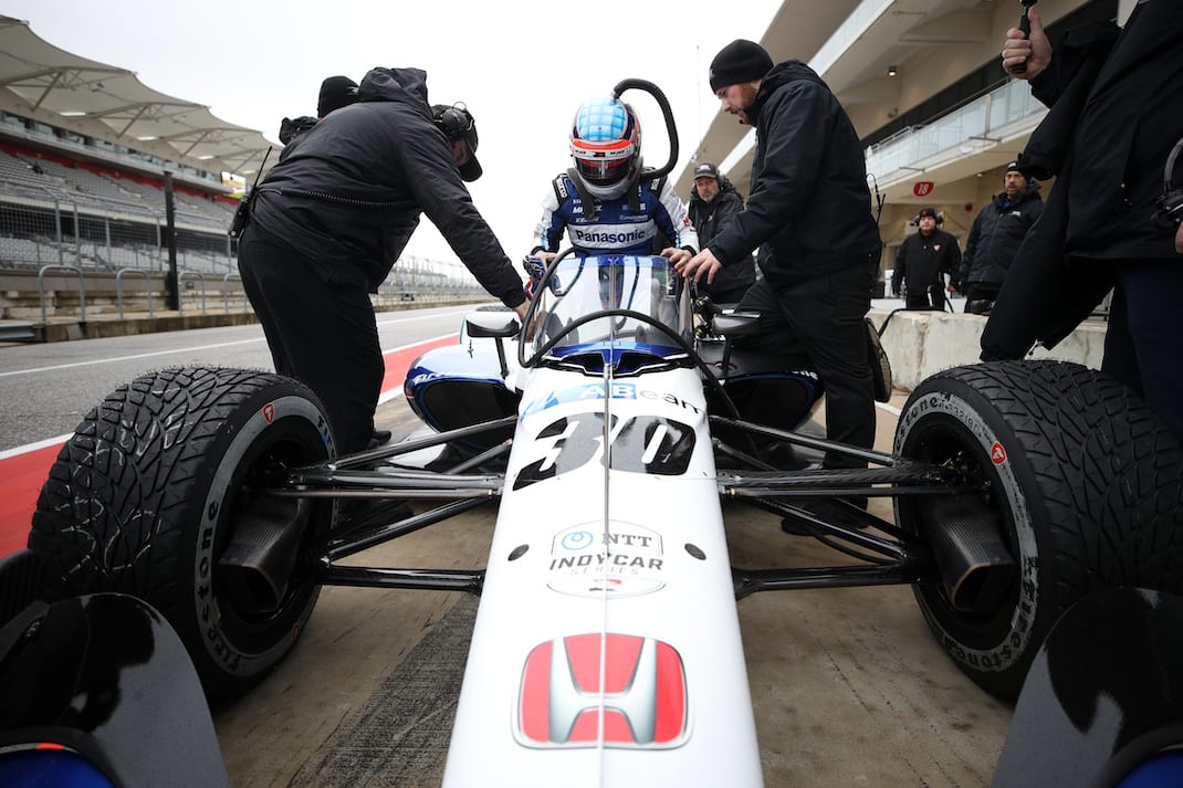 Takuma Sato climbs into his Indy car at Circuit of The Americas. (Photo by Chris Graythen/Getty Images)