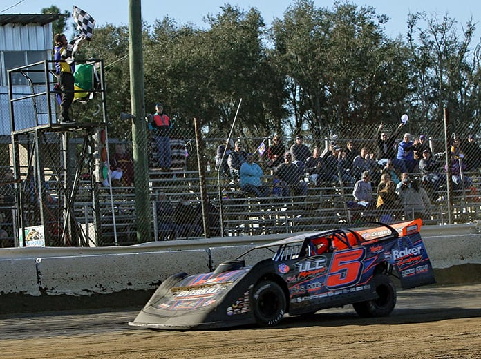 Mark Whitener takes the checkered flag to win Sunday's DIRTcar-sanctioned late model feature at North Florida Speedway. (Jim Denhamer Photo)