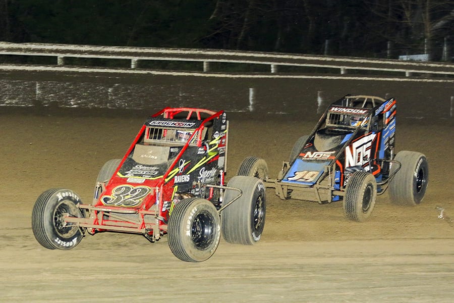 Chase Stockon (32) leads Chris Windom during Friday's USAC AMSOIL National Sprint Car Series opener at Bubba Raceway Park. (Dick Ayers Photo)