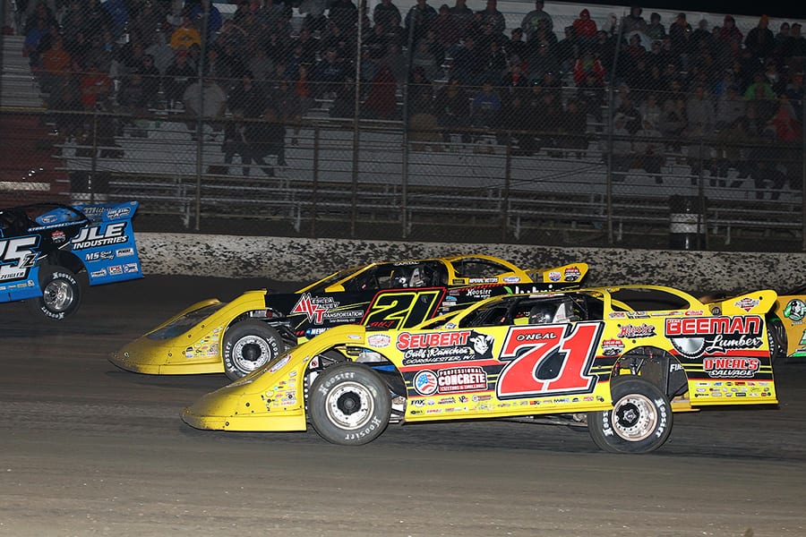 Hudson O'Neal (71) races alongside Billy Moyer Jr. during Monday's Lucas Oil Late Model Dirt Series feature at East Bay Raceway Park. (Mike Ruefer Photo)