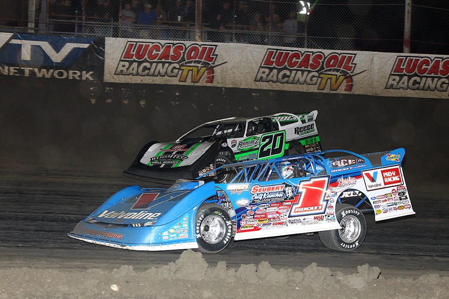 Brandon Sheppard (1) races under Jimmy Owens during Wednesday's Lucas Oil Late Model Dirt Series feature at East Bay Raceway Park. (Mike Ruefer Photo)