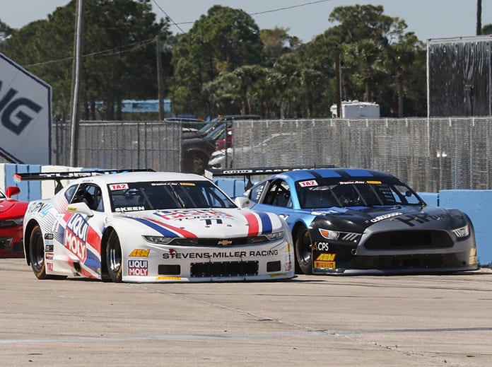 Mike Skeen (left) battles Thomas Merrill for the race lead during a restart in Sunday's Trans-Am Series TA2 event.