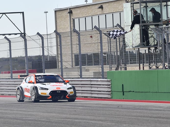 Tyler Maxson takes the checkered flag to win Saturday's TC America opener at Circuit of the Americas.