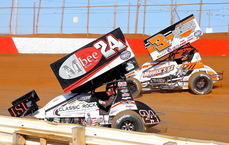Lucas Wolfe (24) races under Brock Zearfoss during Saturday's sprint car feature at Lincoln Speedway. (Dan Demarco Photo)