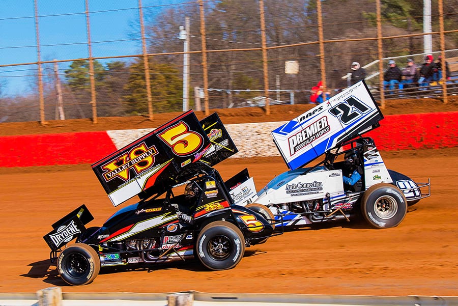 Dylan Cisney (5) races alongside Brian Monteith during Sunday's sprint car event at Lincoln Speedway. (Shawn Cooper Photo)