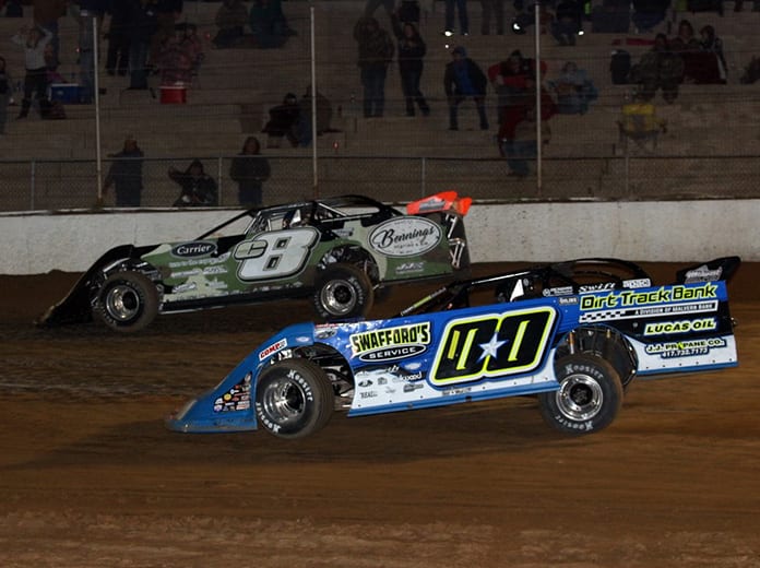 Tyler Erb (c8) passes Jesse Stovall on the last lap to win Friday's COMP Cams Super Dirt Series opener at Boothill Speedway. (Scott Burson Photo)