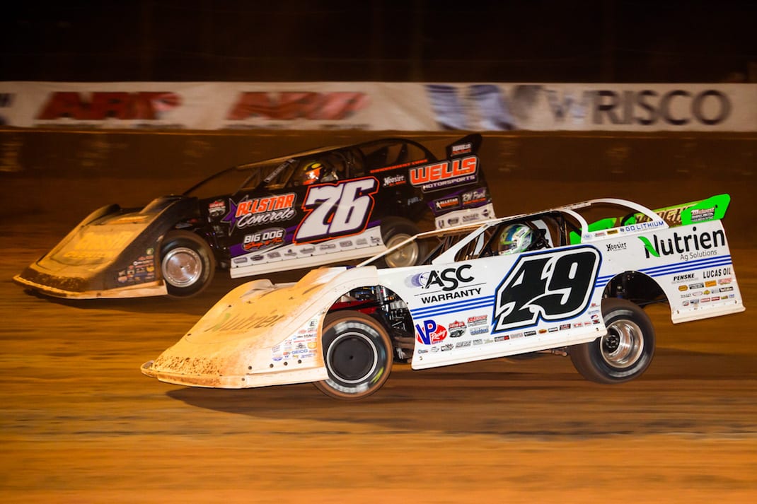 Brandon Overton (76) and Jonathan Davenport, shown at Golden Isles Speedway, battled for the victory Tuesday at East Bay Raceway Park. (Heath Lawson photo)