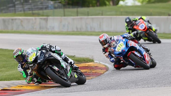 Richie Escalante (54) won his first career Supersport race after Sean Dylan Kelly (40) crashed out of their battle. Brandon Paasch (21) finished second. (Brian J. Nelson Photo)