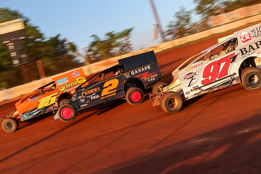 Brett Tonkin (15), Mike Franz (2) and Danny Tyler battle during Short Track Super Series preliminary action on Saturday at Cherokee Speedway. (Adam Fenwick Photo)