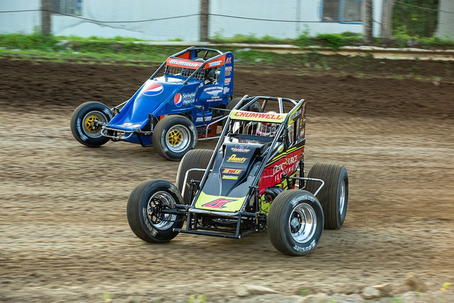 Braydon Cromwell (4) and Nate McMillin battle for position during a POWRi Lucas Oil WAR Sprint League heat race on Saturday at Valley Speedway. (Russell Moore Photo)