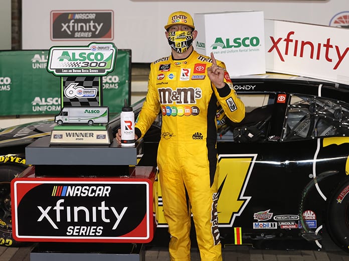 Kyle Busch stands in victory lane after his victory Monday night at Charlotte Motor Speedway. (Chris Graythen/Getty Images Photo)