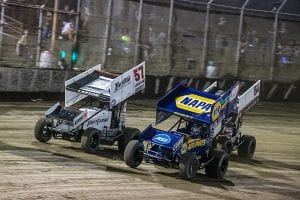 Brad Sweet (49) battles Kyle Larson (57) for the race lead during Friday's World of Outlaws NOS Energy Drink Sprint Car Series event at Federated Auto Parts Raceway at I-55. (Brad Plant Photo)