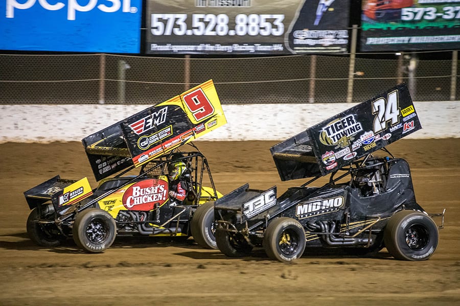 Chase Randell (9) and Garet Williamson race through turn two during Sunday's ASCS Warrior Region event at Lake Ozark Speedway. (Brad Plant Photo)