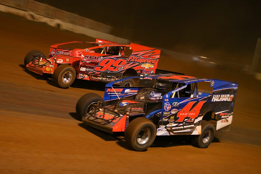 Stewart Friesen (44) races under Larry Wight in a battle for the race lead during Saturday's Short Track Super Series feature at Cherokee Speedway. (Adam Fenwick Photo)