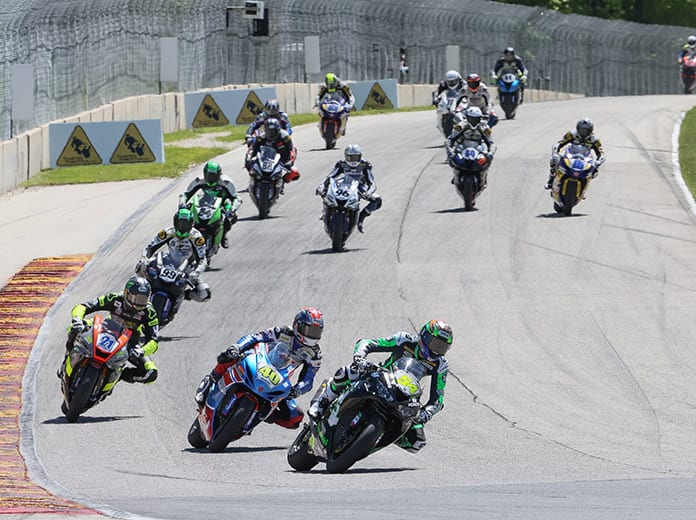 Richie Escalante (54) leads Sean Dylan Kelly (40), Brandon Paasch (21) and the rest of the Supersport pack at Road America on Sunday. (Brian J. Nelson Photo)