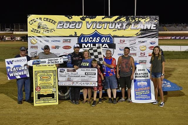 Jesse Stovall and his crew in victory lane on Thursday night at Outlaw Motor Speedway. (Lloyd Collins Photo)