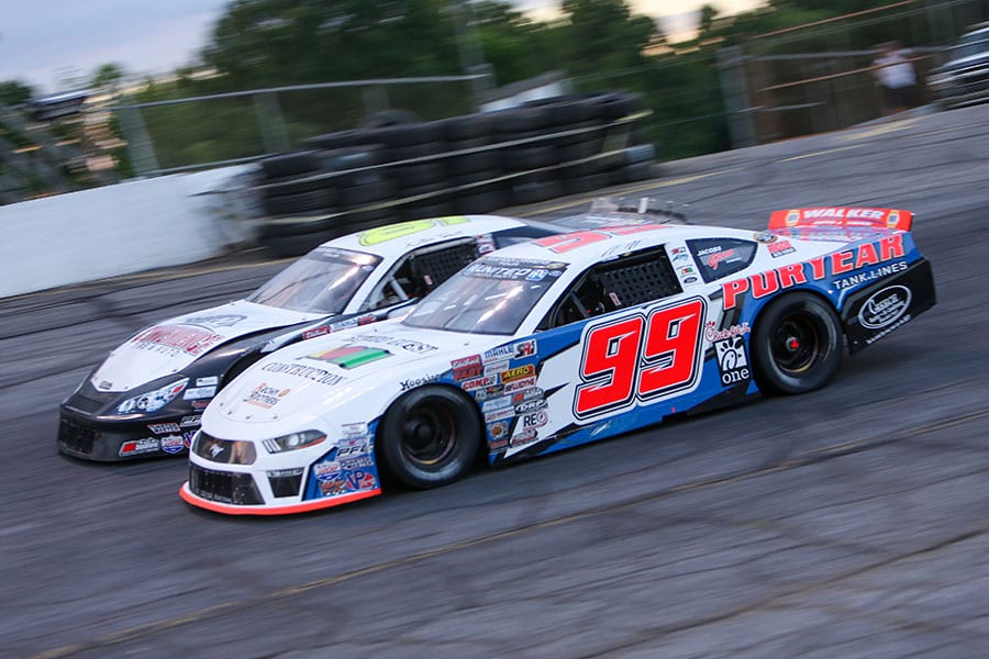 Layne Riggs (99) battles Mini Tyrrell during the late model stock portion of Saturday's CARS Tour event at Hickory Motor Speedway. (Adam Fenwick Photo)