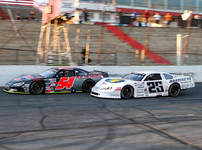 Matt Craig (54) battles Bubba Pollard as they cross under the white flag during Saturday's CARS Super Late Model Tour feature at Hickory Motor Speedway. (Adam Fenwick Photo)