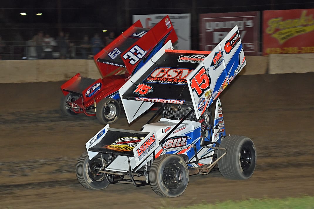 Chad Kemenah (15) races under Caleb Griffith at Fremont Speedway. (Mike Campbell photo)
