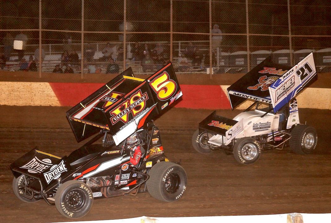 Dylan Cisney (5), shown battling Brian Montieth earlier this year, won Saturday's sprint car feature at Lincoln Speedway. (Dan Demarco photo)