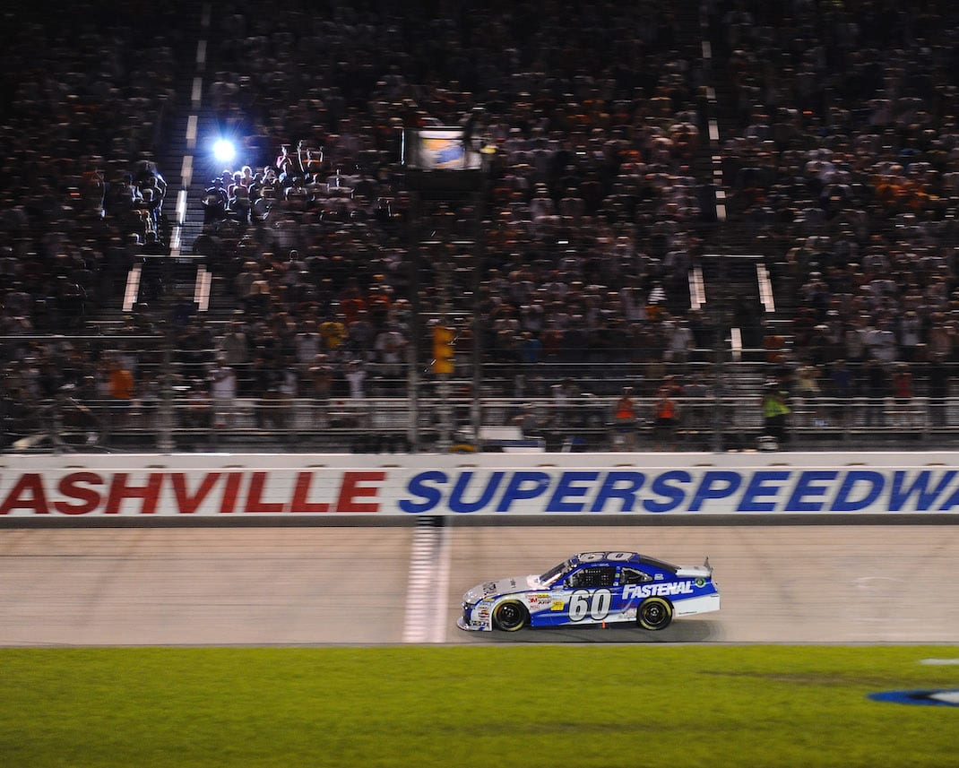 Carl Edwards takes the checkered flag at Nashville Superspeedway in 2011. (NASCAR photo)