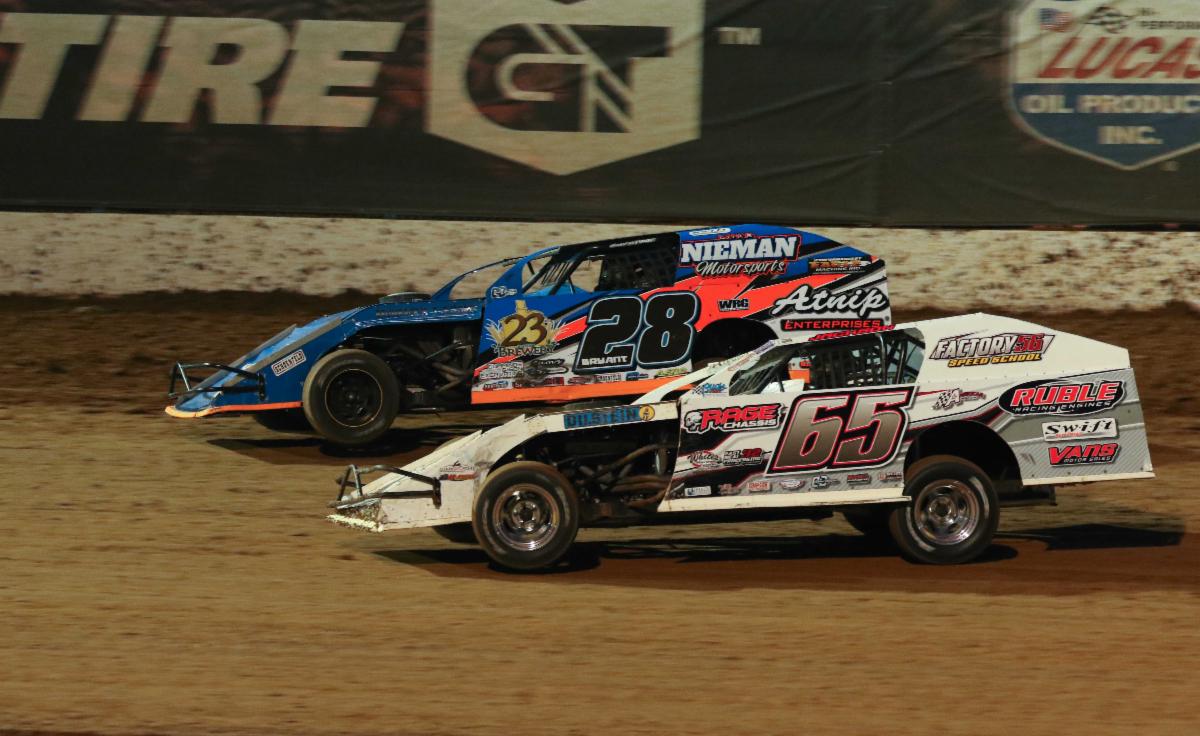 Andy Bryant (28) battles with Kris Jackson in Saturday night's headliner at Lucas Oil Speedway. (GS Stanek Racing Photography)