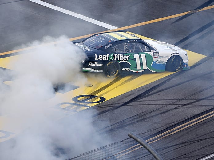 Justin Haley celebrates with a burnout after winning Saturday's NASCAR Xfinity Series Unhinged 300 at Talladega Superspeedway. (Brian Lawdermilk/Getty Images Photo)