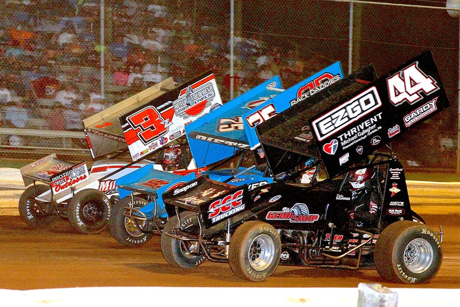 Dylan Norris (44), Chase Dietz (75c) and Brock Zearfoss race three-wide during Monday's PA Speedweek feature at Lincoln Speedway. (Dan Demarco Photo)