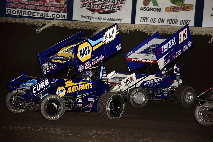 Brad Sweet (49) races ahead of Daryn Pittman during Saturday's World of Outlaws NOS Energy Drink Sprint Car Series event at Tri-State Speedway. (Mark Funderburk Photo)