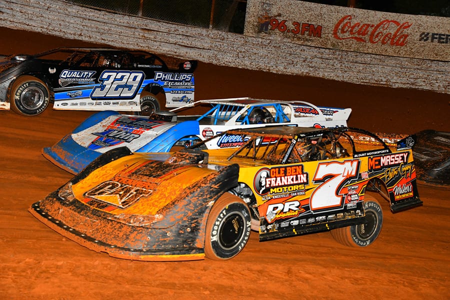 Donald McIntosh (7), Vic Hill (center), and Travis Fultz battle for a transfer spot during a heat race on Saturday during World of Outlaws Morton Buildings Late Model Series competition at Volunteer Speedway. (Michael Moats Photo)