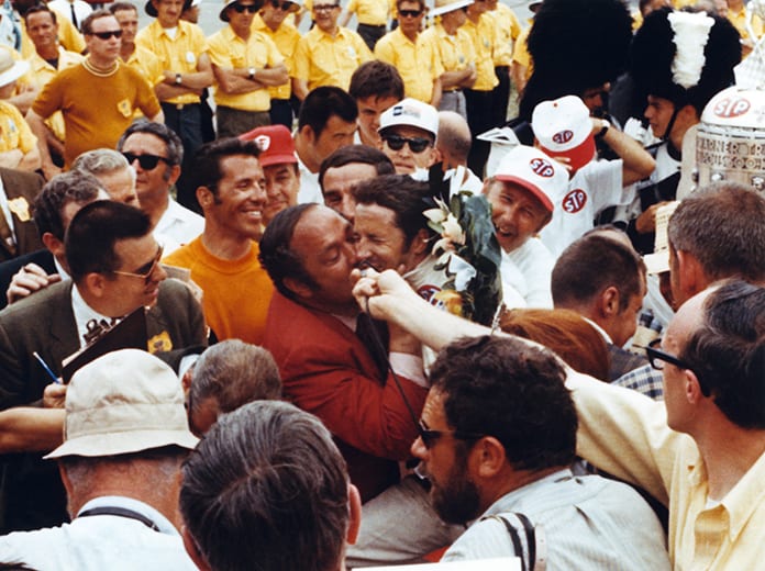 1969 Indianapolis 500 winner Mario Andretti receiving a kiss from car owner Andy Granatelli in victory lane. (IMS Archives Photo)