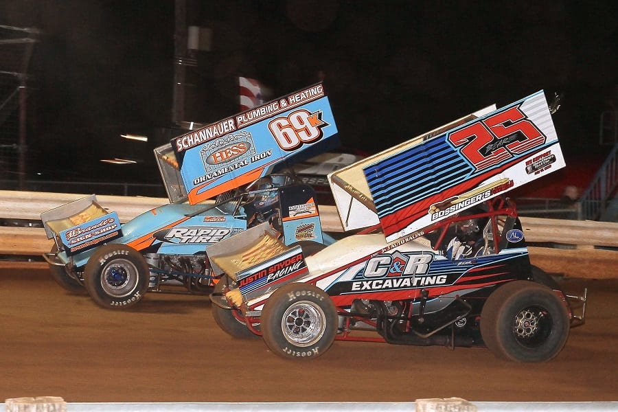 Tyler Bear (25) fends off Lance Dewease during round eight of Pennsylvania Speedweek Friday at Williams Grove Speedway. (Dan Demarco photo)