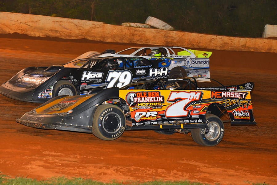 Donald McIntosh (7m) and Kyle Hardy (79) bypass a slower car during Friday's Schaeffer’s Oil Southern Nationals Series feature at 411 Motor Speedway. (Michael Moats Photo)