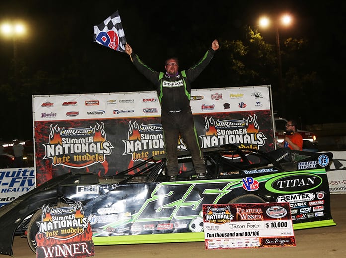 Jason Feger in victory lane Saturday at Highland Speedway. (Terry Page Photo)