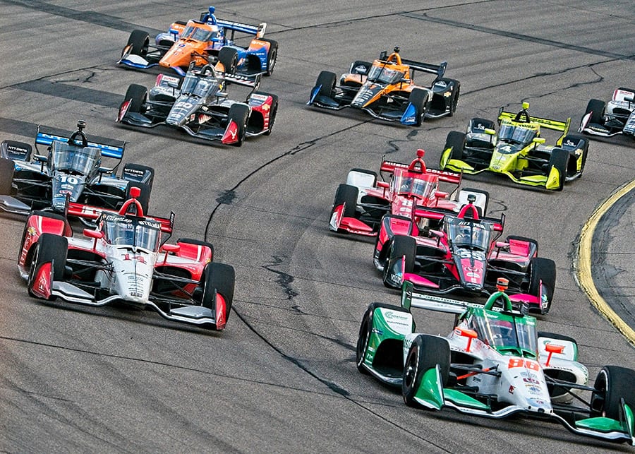 Drivers battle for position during Saturday's NTT IndyCar Series race at Iowa Speedway. (Ray Hague Photo)