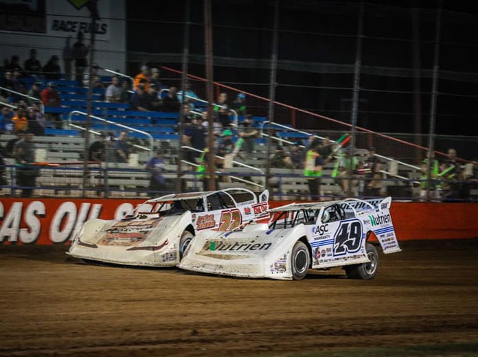 Chris Ferguson (22) and Jonathan Davenport (49) battle it out in the closing laps Sunday night at Lucas Oil Speedway. (GS Stanek Racing Photography)
