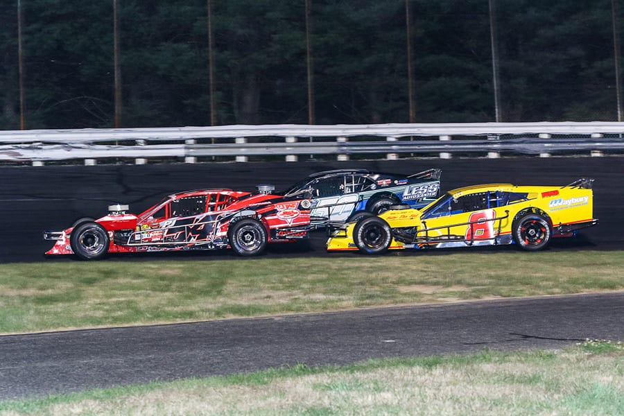 Tommy Catalano (50), Ronnie Williams (50) and Cam McDermott battle for position during Saturday's Bud Light Open Modified 80 at Stafford Motor Speedway. (Dick Ayers Photo)