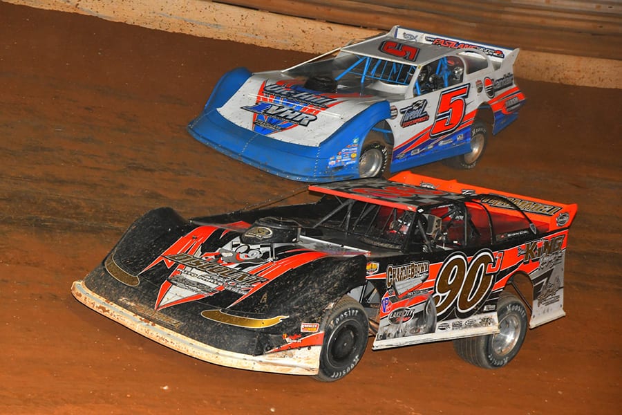 Jason Trammell (90) zips by Vic Hill for the race lead during Friday's Schaeffer's Oil Iron-Man Championship Late Model Series event at Tazewell Speedway. (Michael Moats Photo)